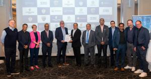 Gerhard Riedl, CEO of Riespo, holds the signed MoU with Arunava Mitra, Vice President of TCG Digital