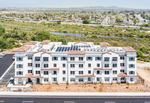Built by Level 3 Construction, South River Village is a four-story Spanish Mission style affordable housing development in Oceanside, California. It features 43 apartments, a children's play area, and two barbeque stations.