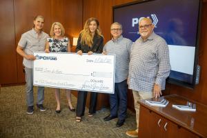 Group photo of PCI leadership and Trees of Hope Executive Director holding a large ceremonial check for the 2025 PCI Powerhouse Fund award.