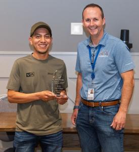 Rafael Teran Melchor poses with award crystal and West Mathison