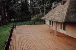 deck at Oregon State University's historic Peavy Hall, where researchers confirmed the preservatives used in today's preserved wood do not leach from the wood and contaminate soil or rainwater runoff.