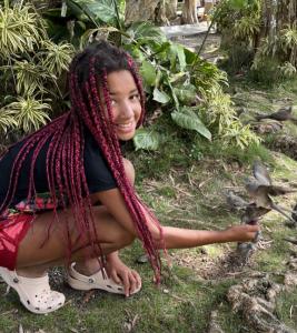 child feeding birds in Hawaii