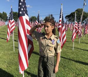 Female Scout honoring veterans on Memorial Day