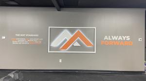 Halo-lit logo sign and 3D PVC dimensional letters installed at MooseFit in Greensboro by Heritage Signs & Displays