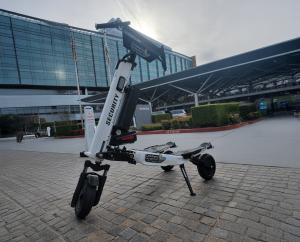 Electric security scooter stationed outside a modern Canadian facility with glass architecture