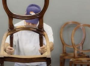Ballard designs dining chair being hand inspected during upholstery process