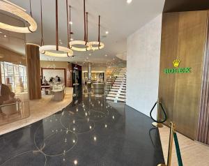 terrazzo design: black terrazzo floor with decorative brass strips with jewelry display cases