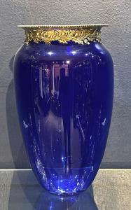 Original Tiffany & Co. deep blue glass vase with the top decorated in 925 sterling silver, weighing 2250 grams. Estimate: $900-$1,500