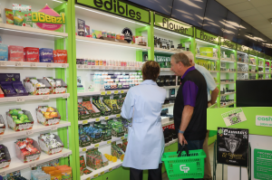 Dr. Dana gives a Friendship Village Resident a tour of GreenPharms Dispensary and Life Is Chill products.