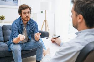 Licensed therapist conducting one-on-one outpatient counseling in Orange County.