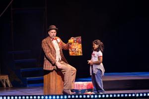 The Ringmaster of Circus 1903 shares a magical moment on stage with a young audience member, bringing charm, laughter, and wonder to the final Jeddah show