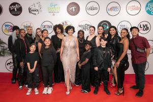 Miss Tee of Studio T Arts & Entertainment shines on the red carpet alongside her talented students, proudly showcasing the next generation of dancers and creatives.