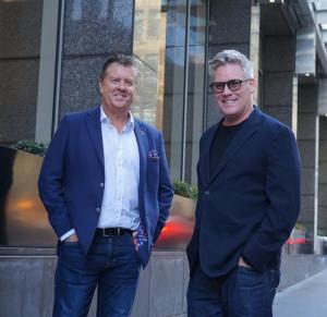 Rob Stummer from Solution Minds Consulting and Mark Cameron from Alyve photographed following the announcement of their national AI strategy partnership for Australian enterprises.