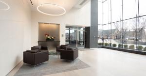 Bright office lobby with seating area and tall windows