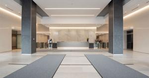 Office reception area flanked by large pillars.