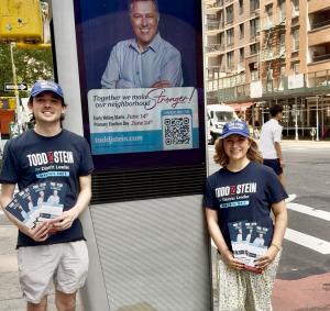 Campaign Members Will and Sam by the Stein Signage on LinksNYC