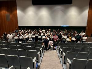 Student of the Texas Leadership Consortium Summer Youth Program receiving certificates of completion