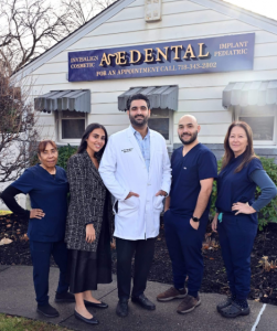 A&E Dental Staff Standing In Front of White A&E Dental Building