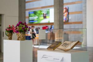 Althea Wiles' 2025 Art in Bloom installation "The Flowers Personified" features floral arrangements inspired by J.J. Grandville's anthropomorphized botanical illustrations. Photo credit: Tommy McFetridge, Courtesy of Crystal Bridges.