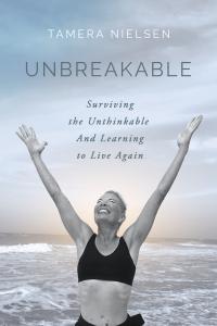 Photo of woman in the Gulf of Mexico arms stretched upwards to the sky with a beaming smile