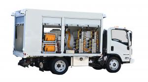  Side view of Real Fleet Solutions’ Tree Spraying Truck with compartment open, revealing integrated equipment tanks, hose reels, and secure storage layout.