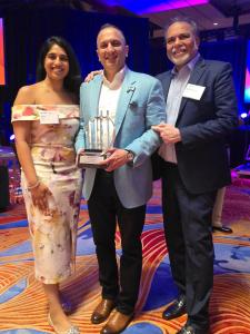 Dr. Yousuf Ahmad, Mahendra Vora, and Anu Vora at EY Awards.