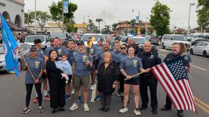 San Fernando police officers running with the Special Olympics torch during the Law Enforcement Torch Run, sponsored by Valley Alarm, June 2025.