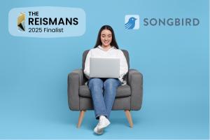 Young woman with long hair seated on chair with a laptop on her lap. A logo for the Reisman Awards on the left and the logo for Songbird legal drafting on the right.