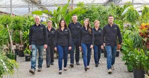 A second and third generation proudly continuing the family legacy inside the greenhouse
