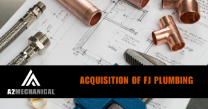 Image showing copper plumbing fittings, braided steel hoses, and a pipe wrench placed on top of architectural blueprints. Overlaid text reads: “Acquisition of FJ Plumbing.” The A2 Mechanical logo is displayed in the bottom left corner.