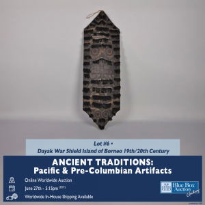 Promotional image for Lot #6 in Blue Box Auction Gallery’s Ancient Traditions: Pacific & Pre-Columbian Artifacts auction. Features a 19th/20th century Dayak war shield from the Island of Borneo, painted with traditional facial motifs and geometric pattern