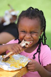 A child eating ribs