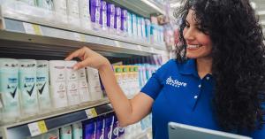 InStore Group Merchandiser arranges products on shelf