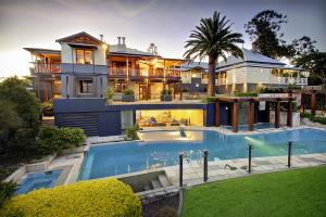 Renovated National Trust home in Auchenflower with upper-level verandahs, modern pool, and underground gym, designed by Dion Seminara Architecture.