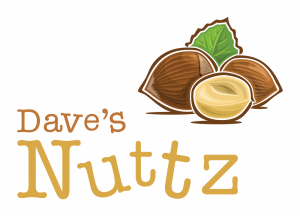 Dave's Nuttz logotype with a hand drawing of a few hazelnuts and a green leaf in the background