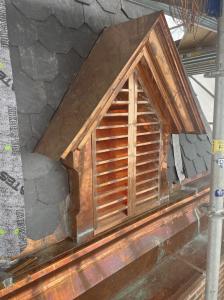 Custom copper dormers meticulusly created to restore a church steeple that sustained storm damage.