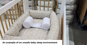 An example of an unsafe baby sleep environment with unsafe sleep positioners in a cot