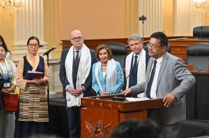 Representative of His Holiness the Dalai Lama at the Office of Tibet DC, Namgyal Choedup speaks at the celebration as (L-R) ICT President Tencho Gyatso, Congressman Jim McGovern, Speaker Emerita Nancy Pelosi, and Congressman Michael McCaul look on.