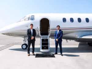 Daniel and Tyler Standing in Front of a Private Jet with Amalfi Jets