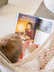 Kids reading and engaged in a book