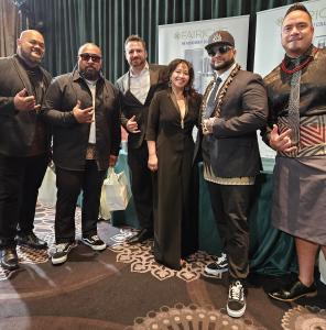 Perlaiché CEO, Vicki Nguyen, InStyler Brands CEO Dan Fugardi and rock band the Common Kings standing together on the red carpet