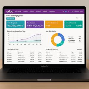 A high-resolution laptop screen displaying a Odoo banking software interface with financial metrics, built for a U.S. banking client.