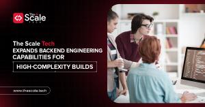 The Scale Tech sets a new standard for web design and development in 2025, team meeting in progress.
