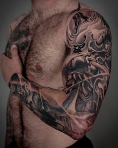 Japanese traditional tattoo half sleeve piece featuring a dragon by Austin tattoo artist Tyler Ciarlanti