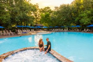 couple sitting at pool