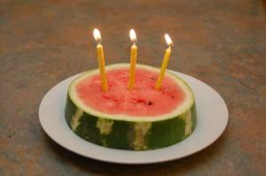 Watermelon with birthday candles, symbolizing remembrance of Bekah and her love of watermelon.
