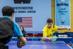 Cole Rothenberger performing a backhand shot at the 2025 Westchester Open, photographed by Rich London.