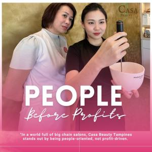 Two female facial therapists at Casa Beauty Tampines preparing a Maria Galland facial mask, representing the salon’s mentorship culture and people-first philosophy.