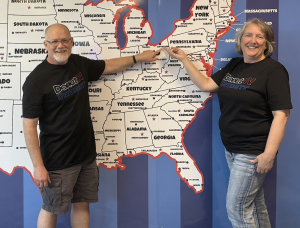 New DonutNV franchise owners point to a map showing their territory location in Kent-Solon, Ohio