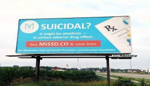 A billboard featuring a prescription pad and information about akathisia and medication-induced suicidality.